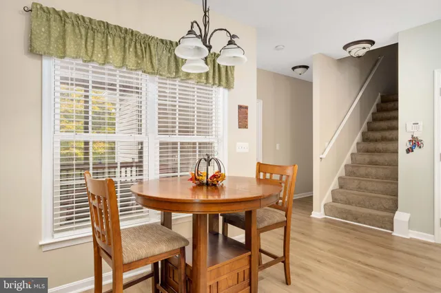 a bedroom with a bed and ceiling fan