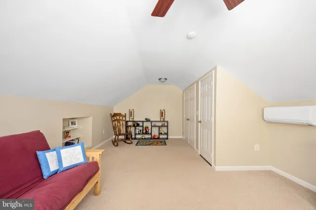 a view of walk in closet with clothes