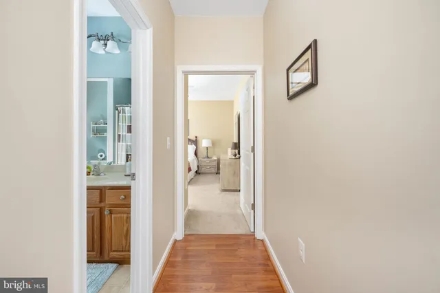 a view of a livingroom with workspace and a window