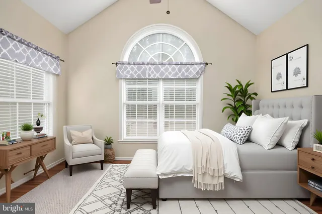 a view of a yard with plants and trees