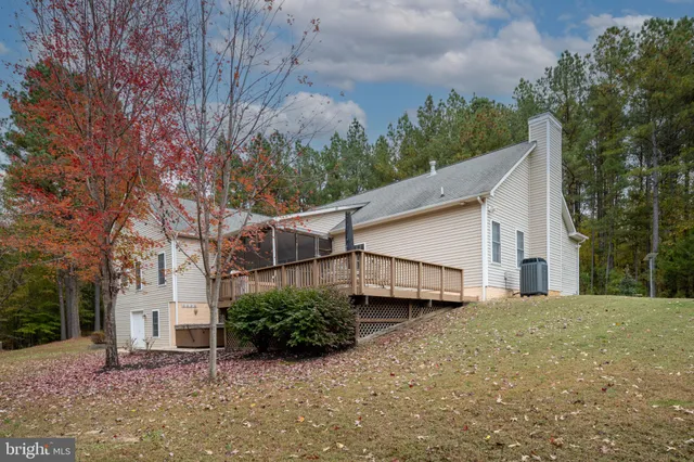 a city view from a balcony with wooden stairs