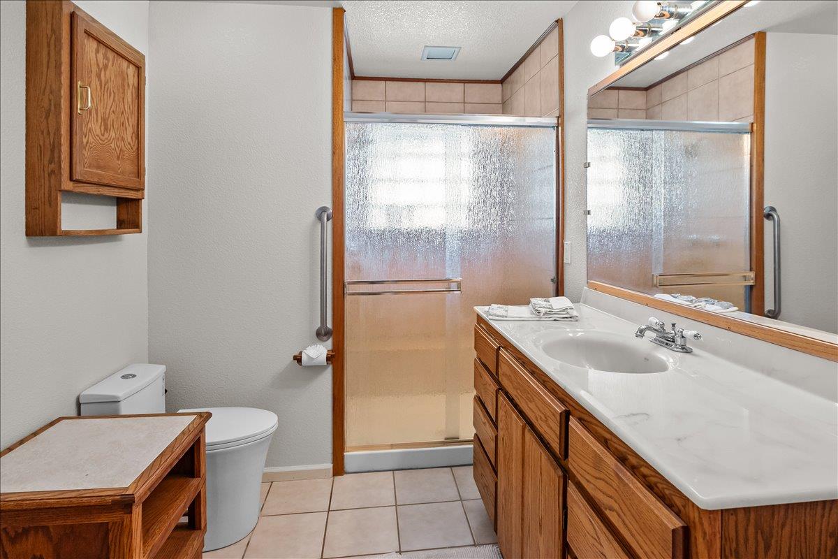 893 Wetherbee Avenue Manteca, CA 95337 - Photo 20 of 39 a bathroom with a sink a toilet and shower