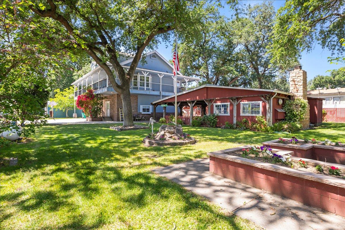 893 Wetherbee Avenue Manteca, CA 95337 - Photo 28 of 39 a front view of a building with garden