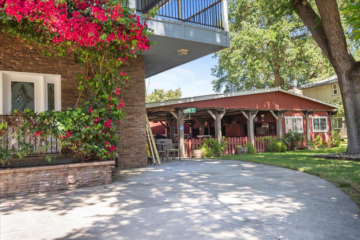 893 Wetherbee Avenue Manteca, CA 95337 - Photo 3 of 39 a front view of a house with a yard