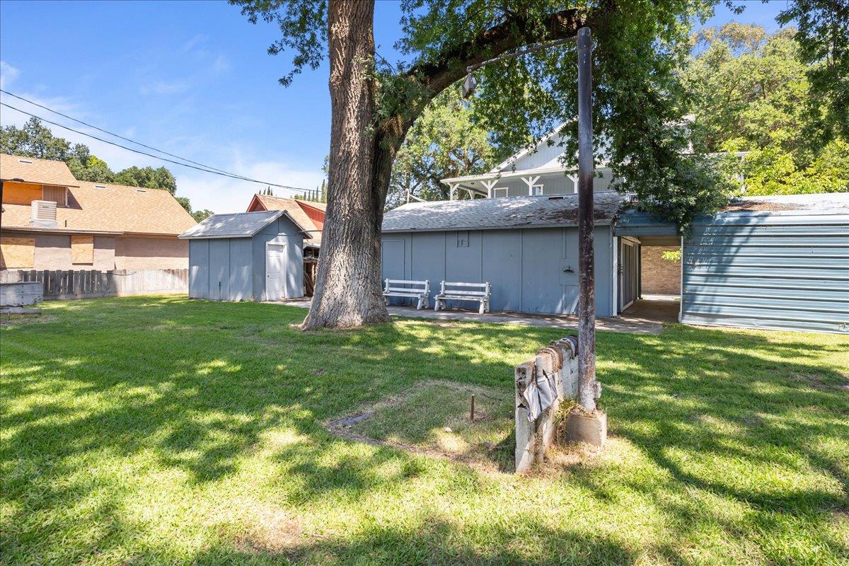 893 Wetherbee Avenue Manteca, CA 95337 - Photo 33 of 39 a backyard of a house with lots of green space