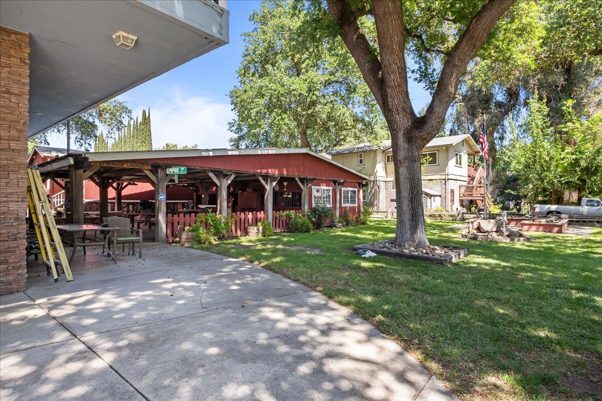 893 Wetherbee Avenue Manteca, CA 95337 - Photo 37 of 39 a view of a house with backyard and a tree