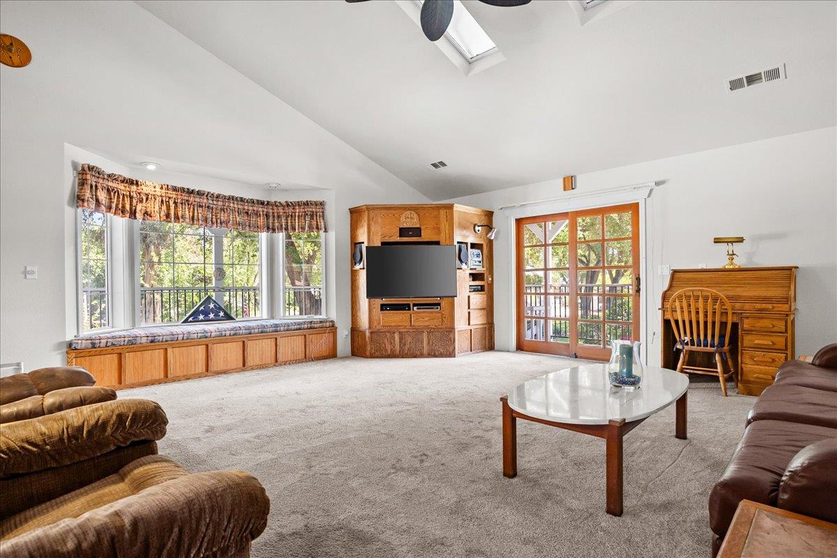 893 Wetherbee Avenue Manteca, CA 95337 - Photo 9 of 39 a living room with furniture and a window