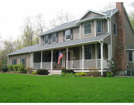 600 Boston Road Groton, MA 01450 - Photo 2 of 13 a front view of a house with a yard