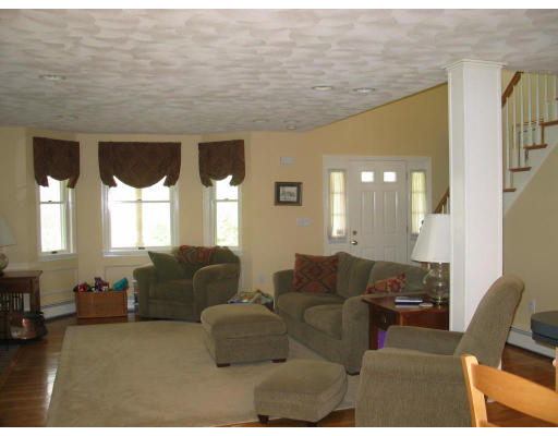 600 Boston Road Groton, MA 01450 - Photo 7 of 13 a living room with furniture and a large window