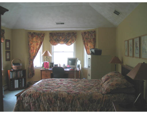 600 Boston Road Groton, MA 01450 - Photo 9 of 13 a bedroom with a bed and a large window