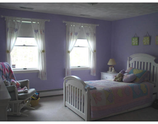 600 Boston Road Groton, MA 01450 - Photo 10 of 13 a bedroom with a bed and windows
