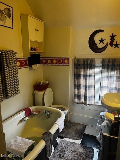 362 Howe Street Akron, OH 44307 - Photo 14 of 23 Bathroom with toilet, a bathtub, and vaulted ceiling