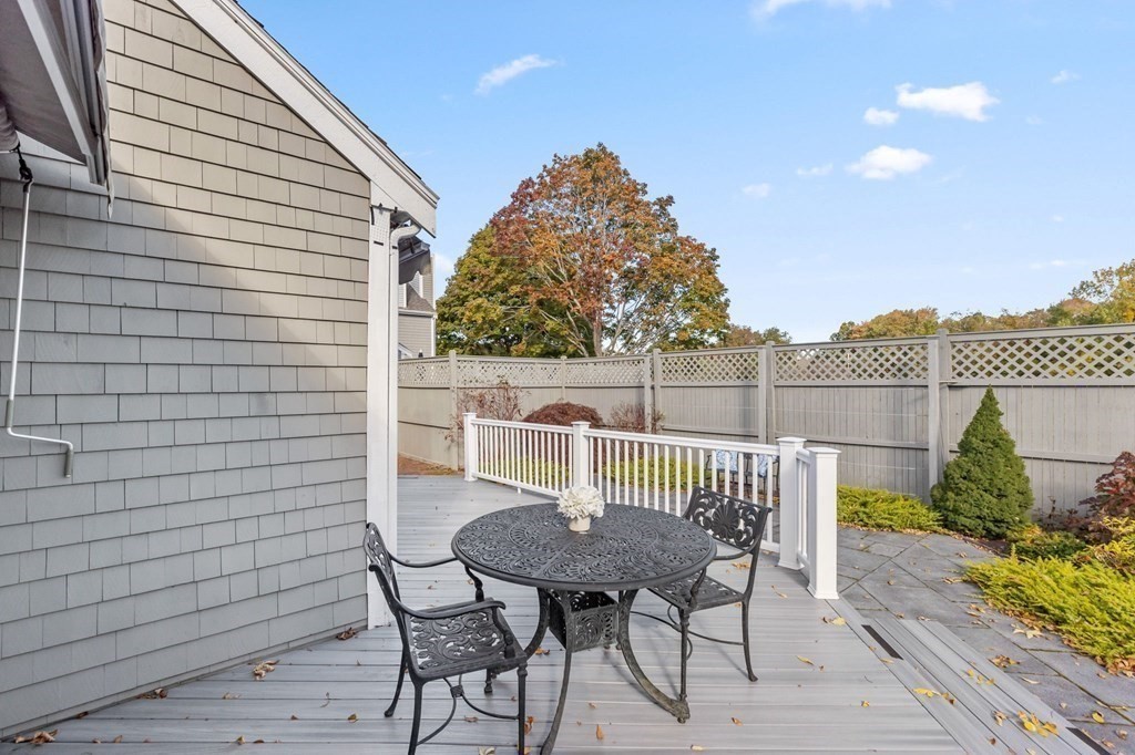 50 Floret Circle, Unit 50 Hingham, MA 02043 - Photo 20 of 28 a view of a chairs and table in patio