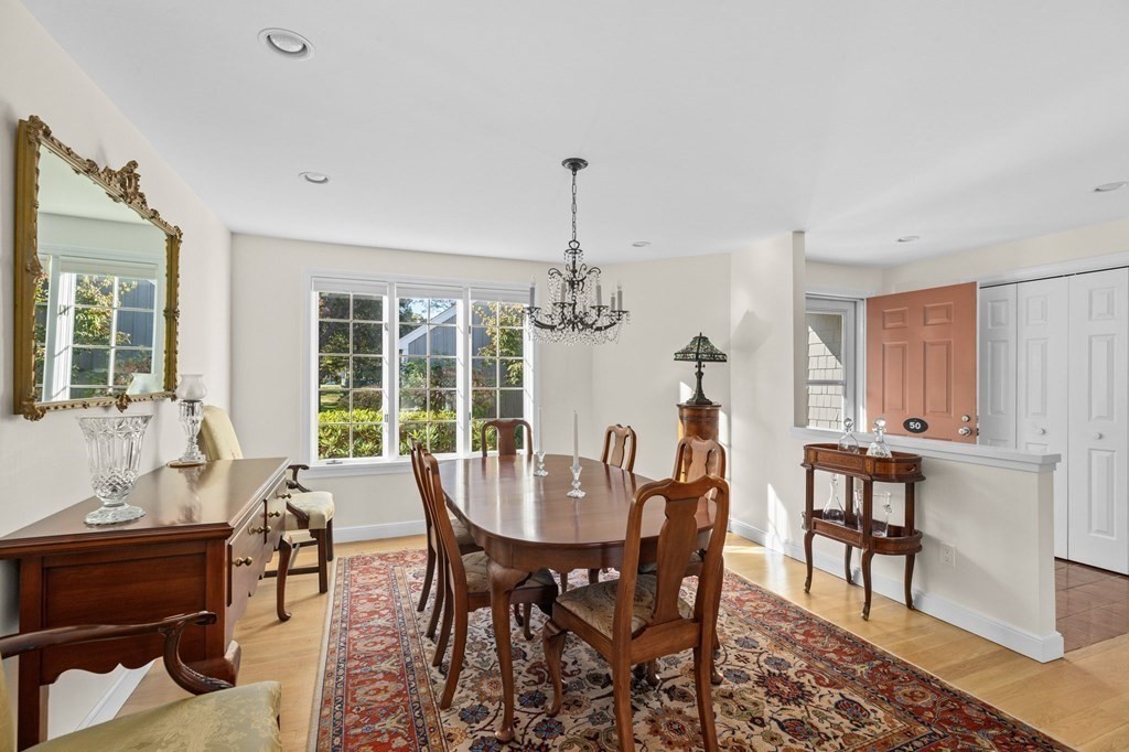 50 Floret Circle, Unit 50 Hingham, MA 02043 - Photo 7 of 28 a view of a dining room with furniture window and outside view