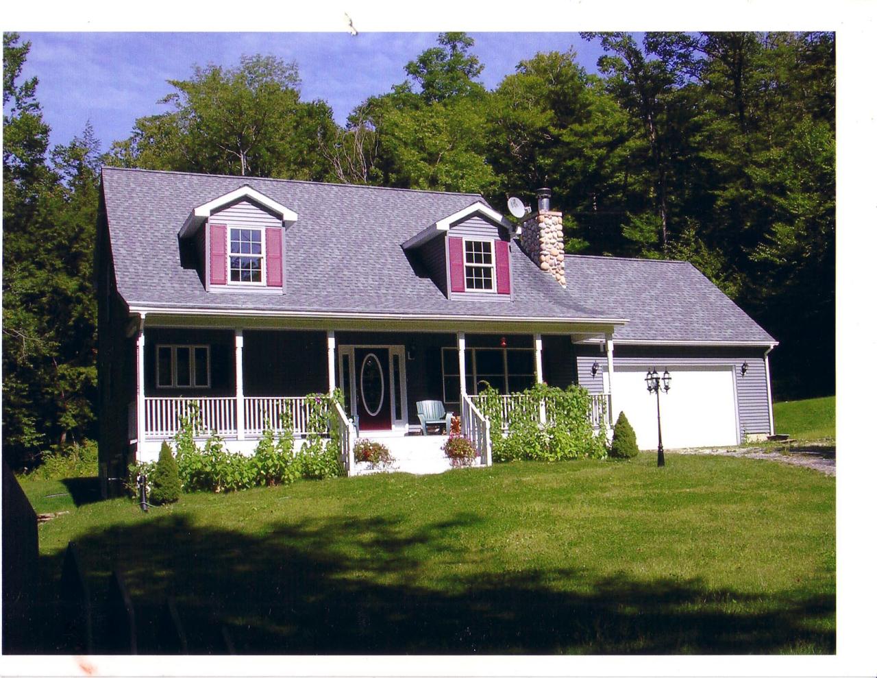 11 Elk Road Sandisfield, MA 01255 - Photo 1 of 14 a front view of a house with garden