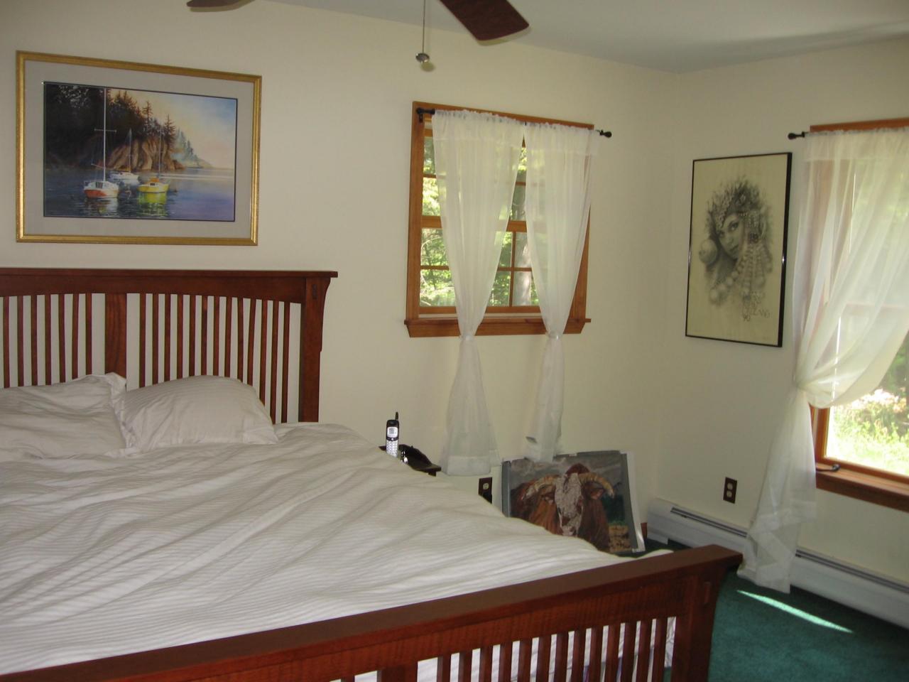 11 Elk Road Sandisfield, MA 01255 - Photo 4 of 14 a bedroom with a bed and a painting on the wall