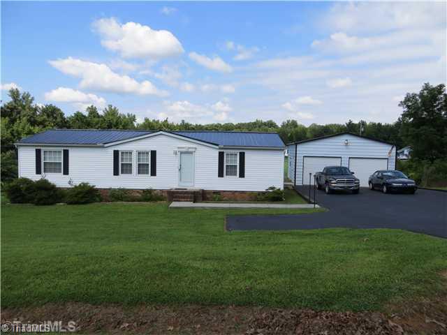 343 Will Boone Road Mocksville, NC 27028 - Photo 2 of 16 Exterior Front. Two car detached garage is 24 x 25 with electric door openers, security lighting and side man door.
