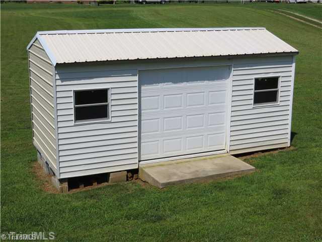 343 Will Boone Road Mocksville, NC 27028 - Photo 14 of 16 Storage. This metal shed is 20 x 9 . It is set up for storage and workshop area.