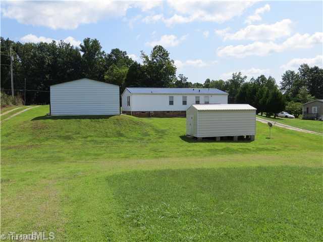 343 Will Boone Road Mocksville, NC 27028 - Photo 16 of 16 Exterior Back. The lot is large at .65. There are homes behind this one but a great deal of vacant space between.
