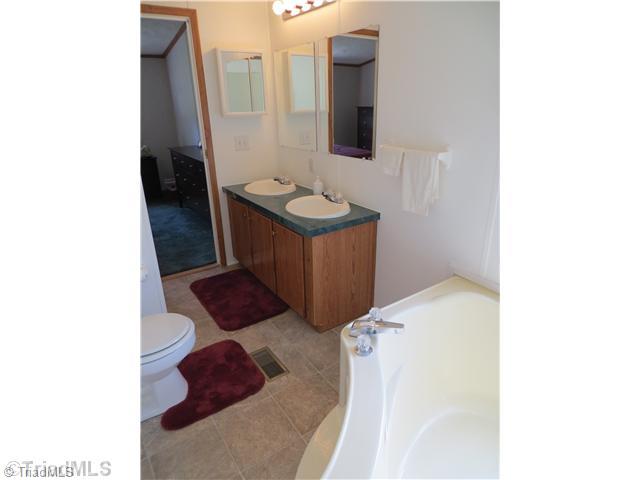 343 Will Boone Road Mocksville, NC 27028 - Photo 7 of 16 Master Bath/Spa. Double vanities, huge soaker tub with privacy window and separate shower.