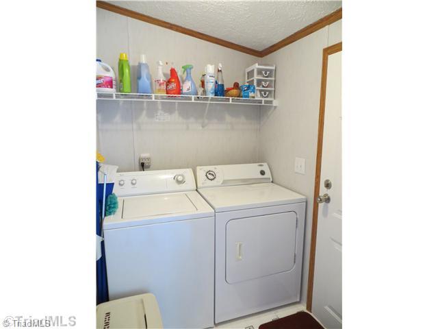 343 Will Boone Road Mocksville, NC 27028 - Photo 8 of 16 Laundry Room. This laundry is off the kitchen with back door opening onto the deck. Perfect when you re coming in from mowing the yard. Washer and dryer remain.