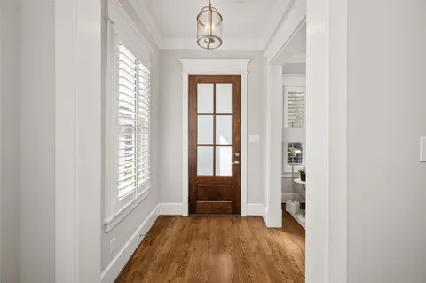 a view of front door with wooden floor
