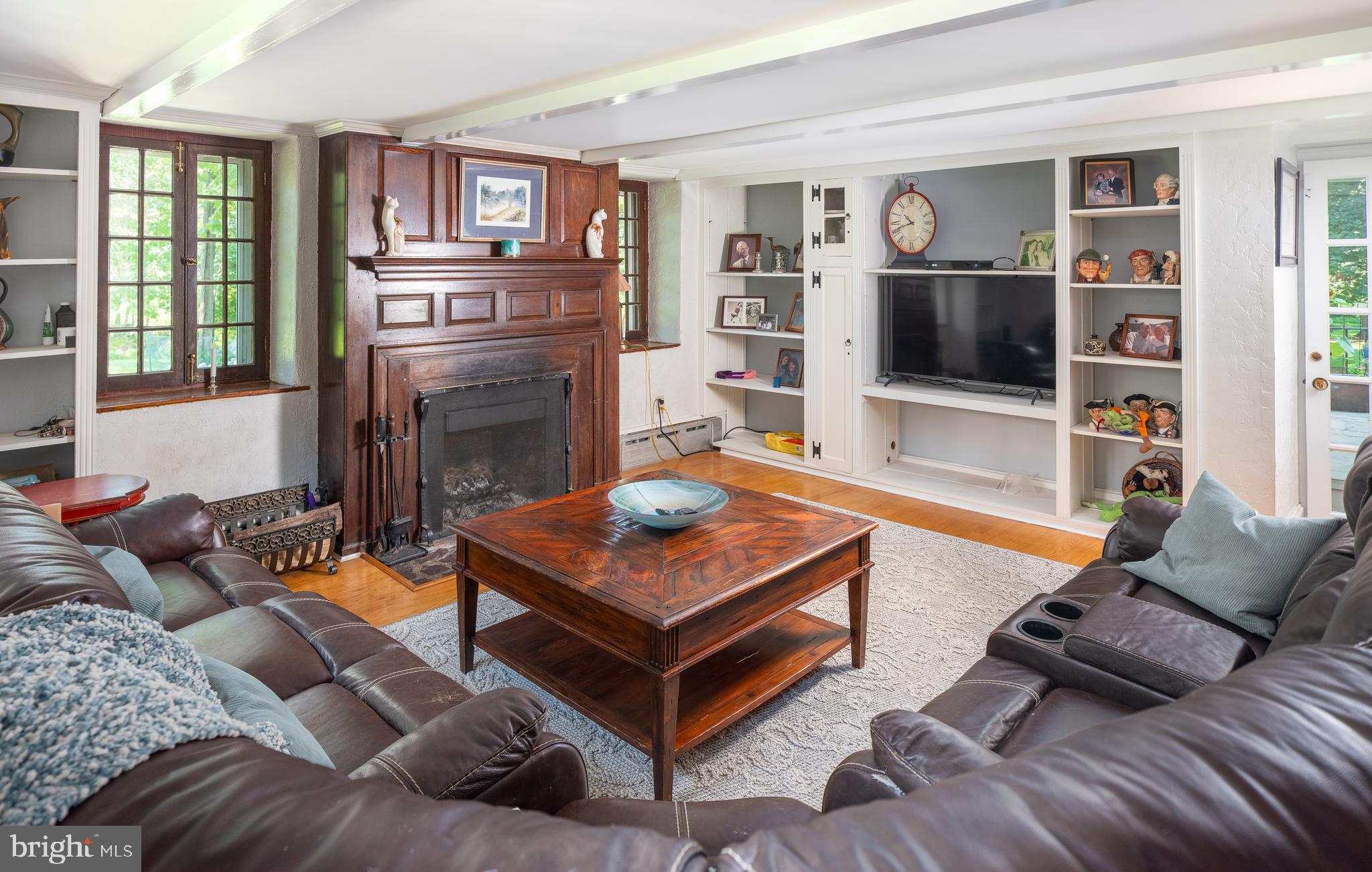 2606 North Sugan Road New Hope, PA 18938 - Photo 14 of 47 Family Room with built-in Shelves and Fireplace
