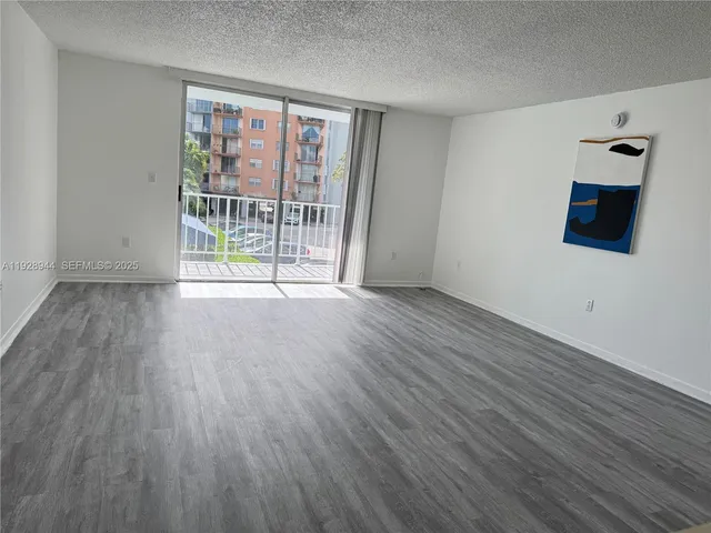 a view of a balcony with two chairs
