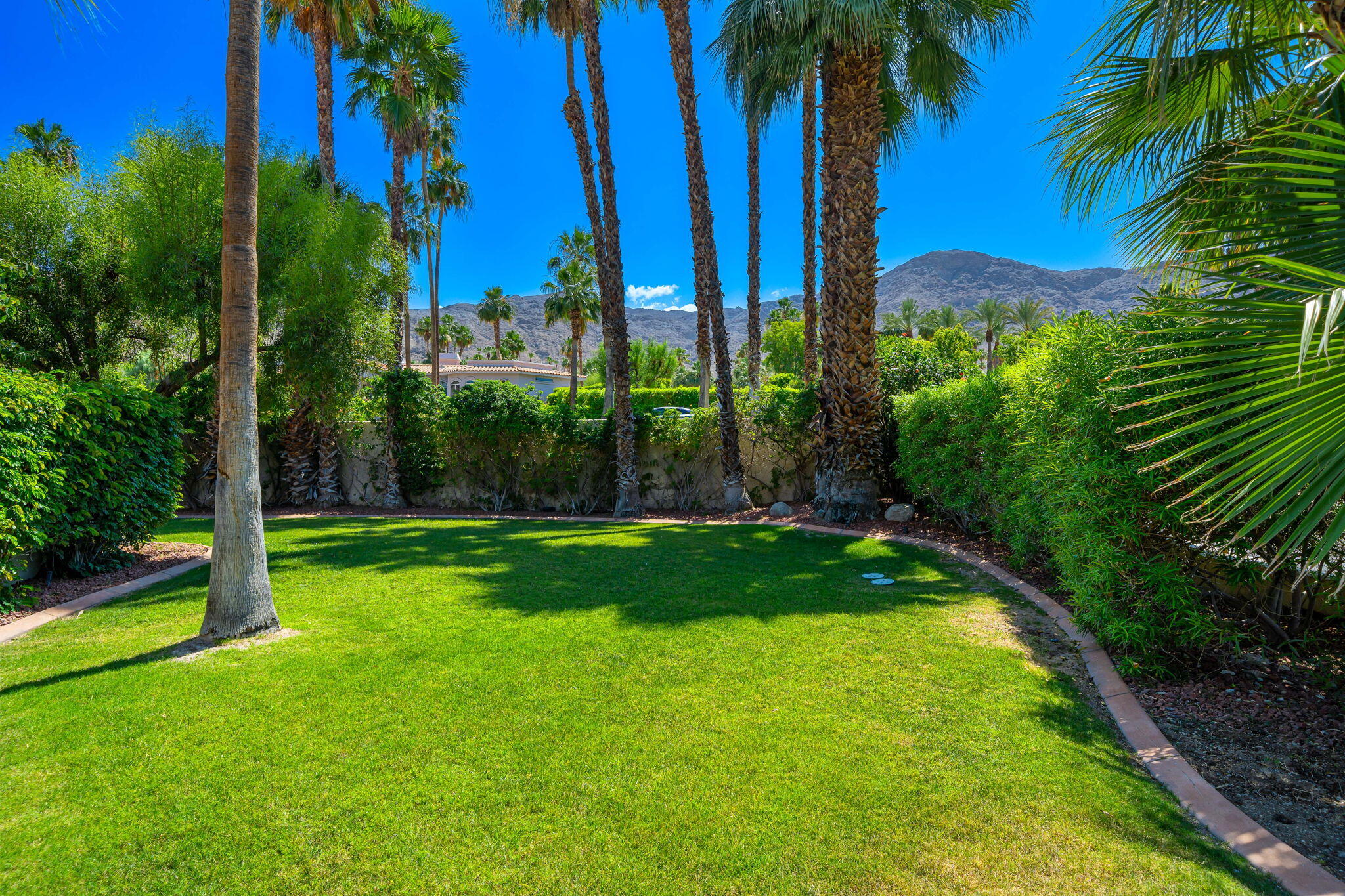 5 Terrace Place Rancho Mirage, CA 92270 - Photo 12 of 53 a view of a yard and entertaining space