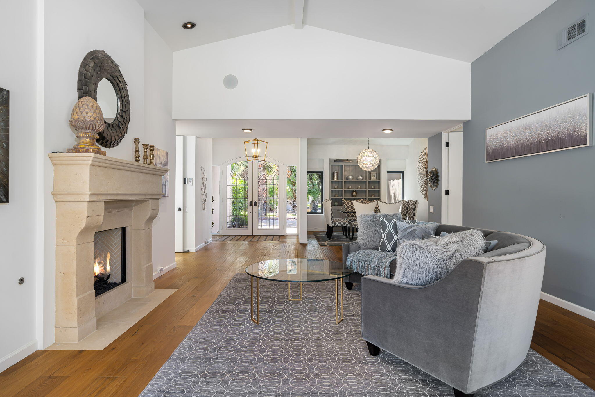 5 Terrace Place Rancho Mirage, CA 92270 - Photo 19 of 53 a living room with furniture a fireplace and a potted plant
