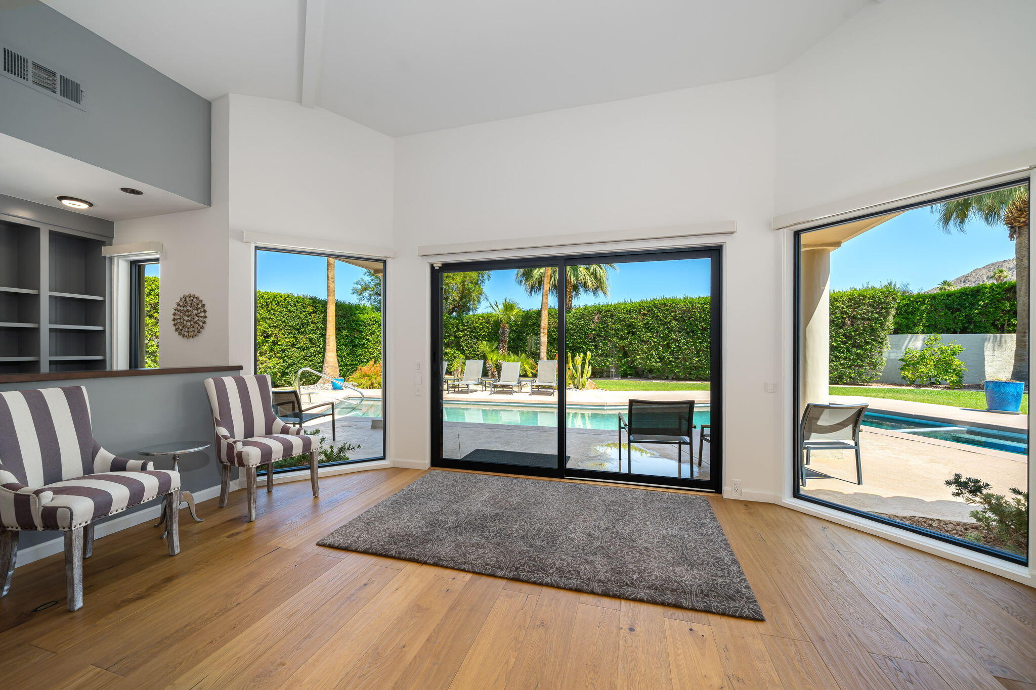 5 Terrace Place Rancho Mirage, CA 92270 - Photo 21 of 53 a living room with furniture and large windows