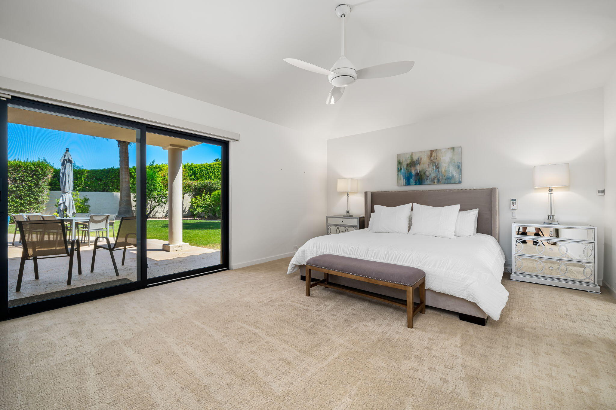 5 Terrace Place Rancho Mirage, CA 92270 - Photo 31 of 53 a spacious bedroom with a bed and a large window