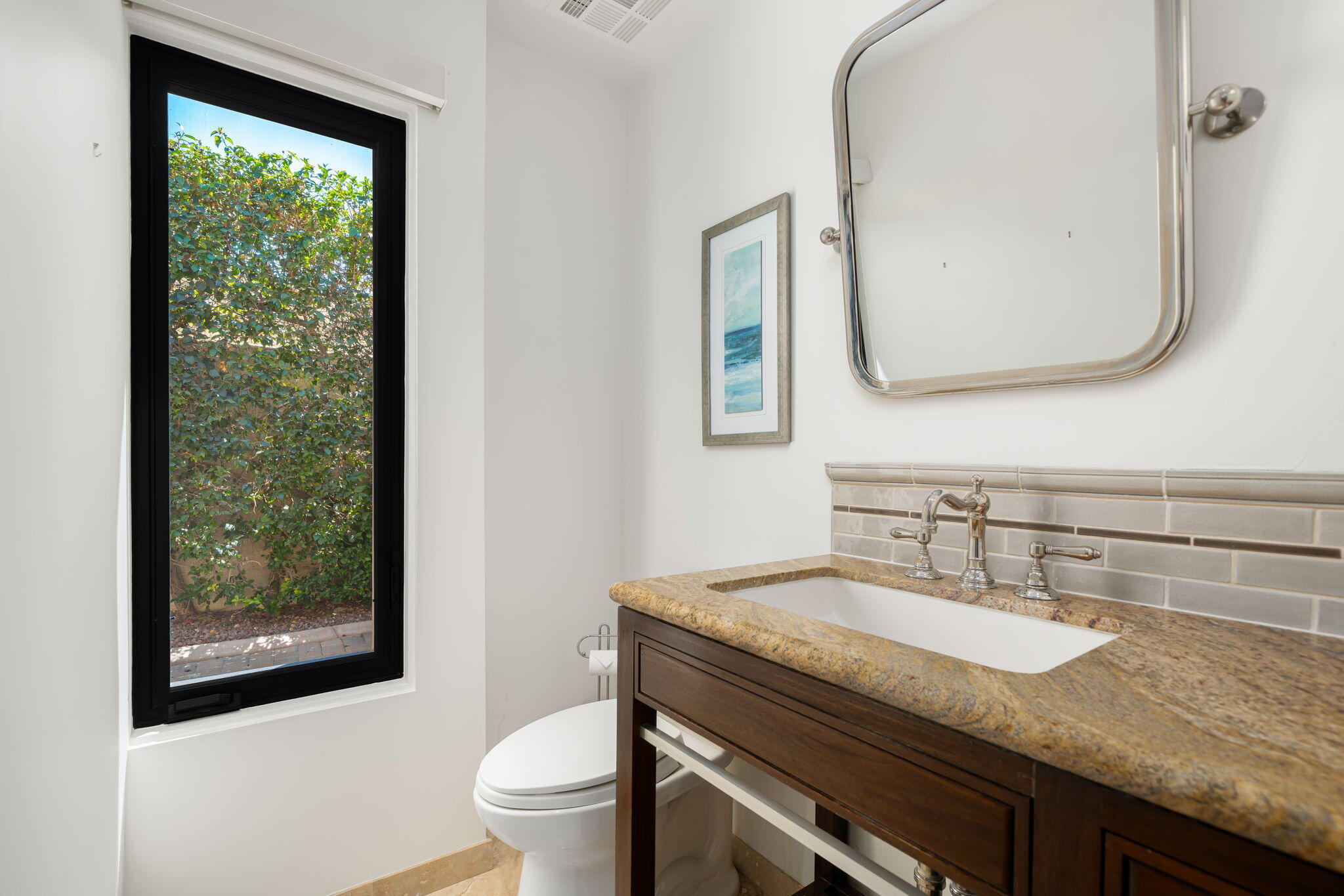 5 Terrace Place Rancho Mirage, CA 92270 - Photo 37 of 53 a bathroom with a granite countertop sink a toilet and a mirror