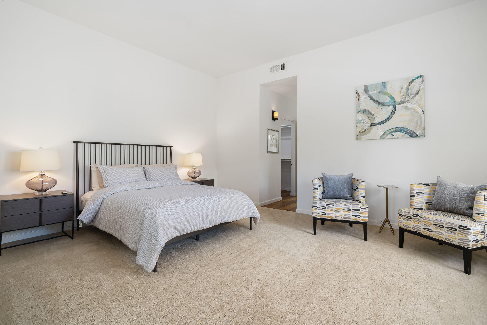 5 Terrace Place Rancho Mirage, CA 92270 - Photo 40 of 53 a bedroom with a bed and a couch
