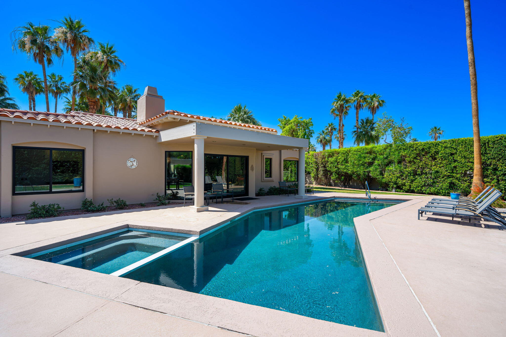 5 Terrace Place Rancho Mirage, CA 92270 - Photo 50 of 53 a view of house with swimming pool outdoor seating