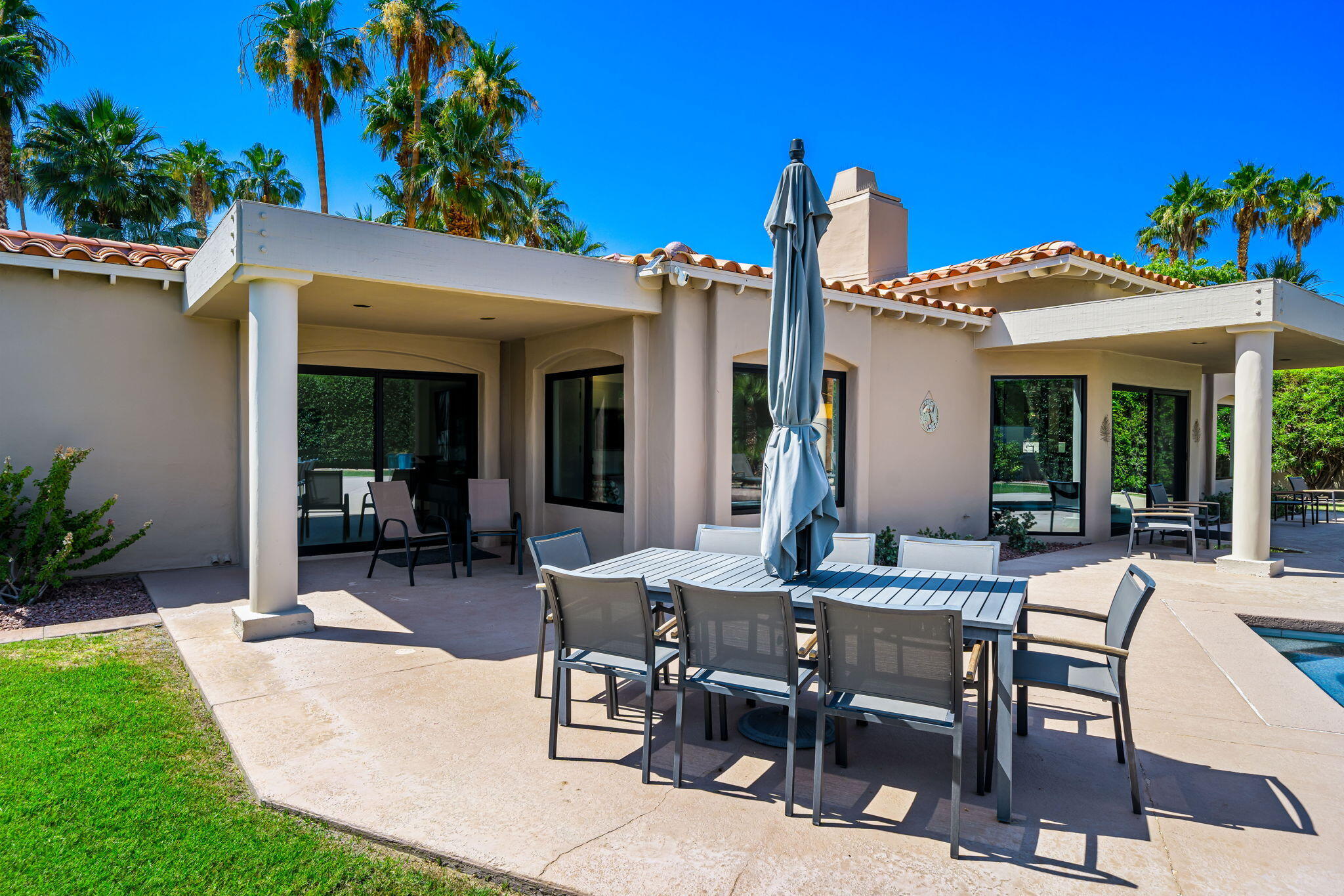 5 Terrace Place Rancho Mirage, CA 92270 - Photo 52 of 53 a view of a patio with a table and chairs