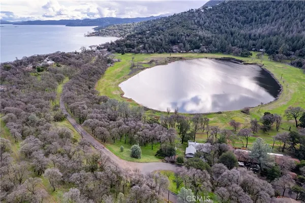 an aerial view of lake with residential house