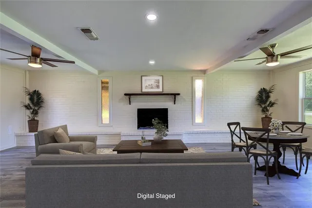 a living room with furniture and a fireplace