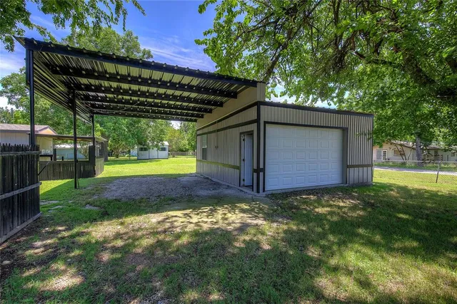 a view of a backyard with swimming pool
