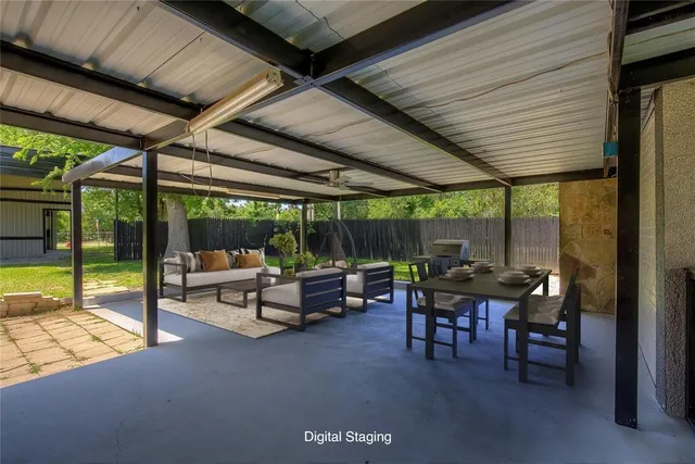 a view of a patio with a table chairs and a backyard