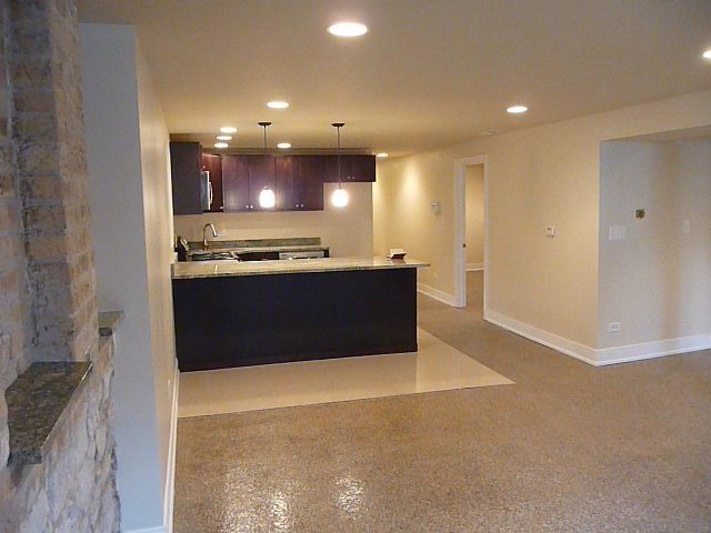 1803 West Superior Street, Unit GDN Chicago, IL 60622 - Photo 5 of 14 a kitchen with stainless steel appliances a stove refrigerator sink and cabinets