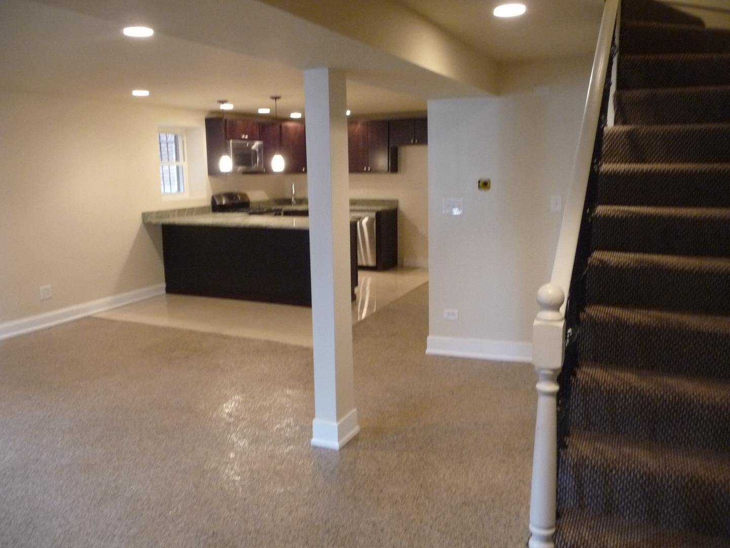 1803 West Superior Street, Unit GDN Chicago, IL 60622 - Photo 6 of 14 a view of a kitchen with a sink and a refrigerator