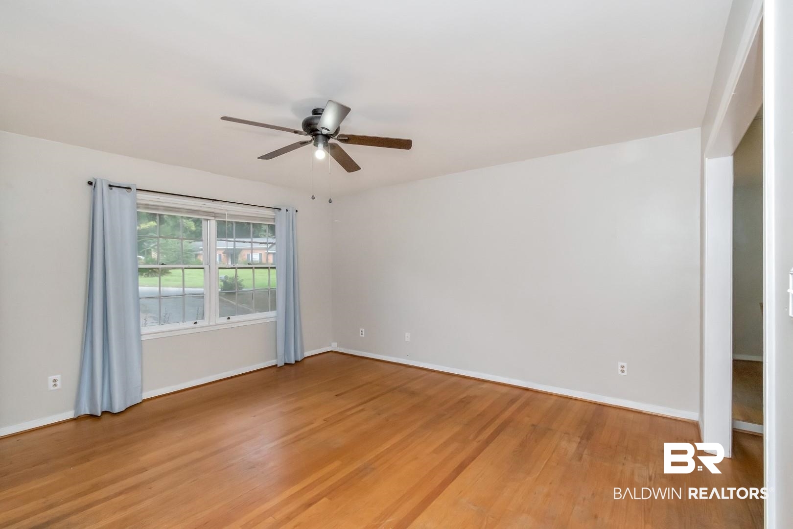 320 Vanderbilt Drive Mobile, AL 36608 - Photo 7 of 39 Unfurnished room with ceiling fan and wood-type flooring
