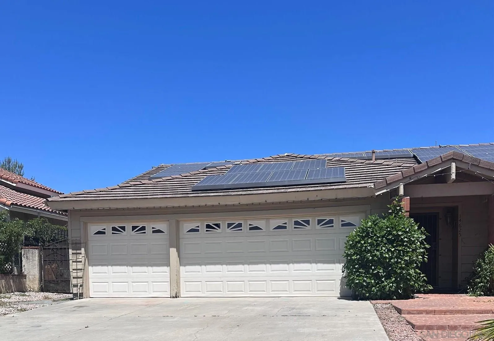 a front view of a house with a garage
