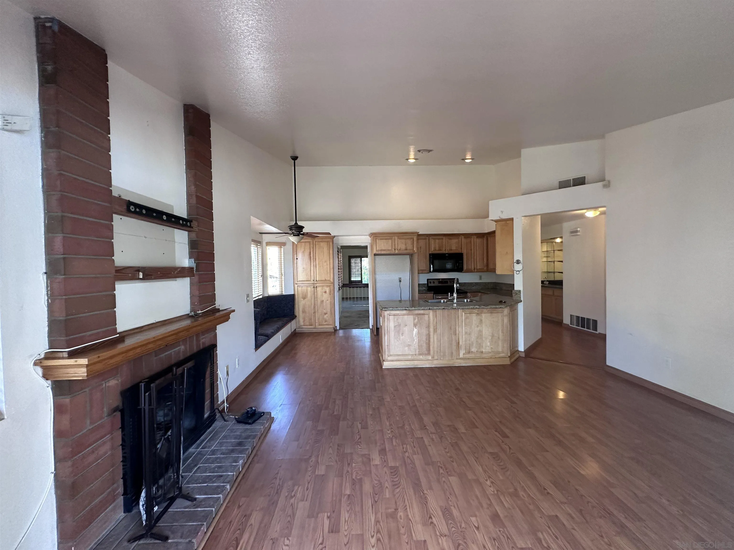 14625 Silverset Street Poway, CA 92064 - Photo 3 of 7 a view of kitchen with cabinets and wooden floor