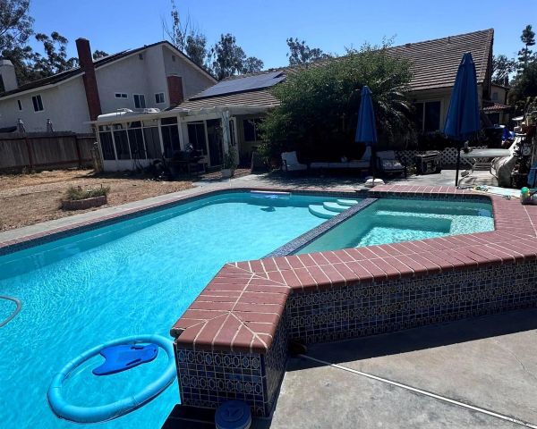 a view of a yard with furniture and a fire pit