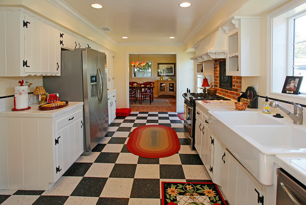 1290 Vallecito Road Carpinteria, CA 93013 - Photo 3 of 12 a kitchen with a sink and a stove top oven