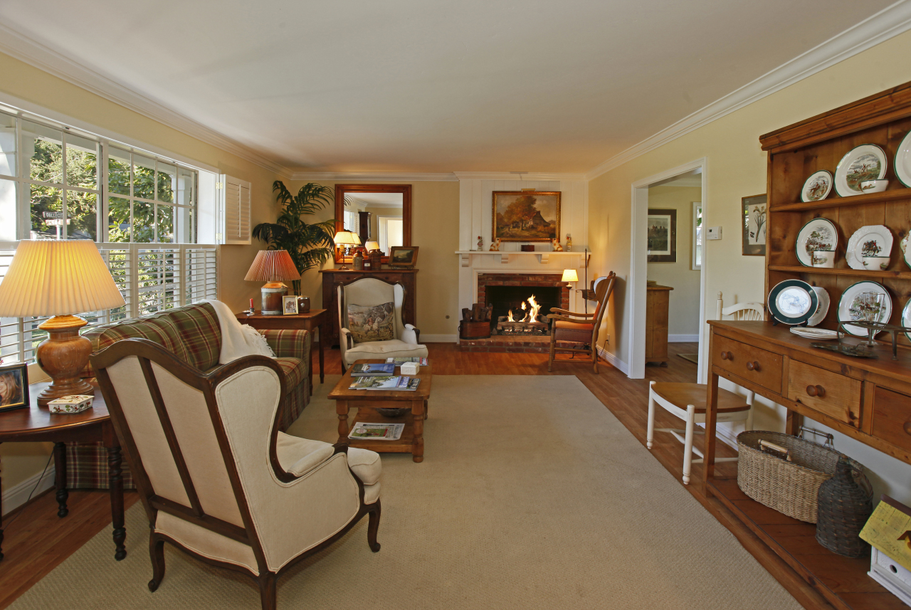 1290 Vallecito Road Carpinteria, CA 93013 - Photo 4 of 12 a living room with furniture a fireplace and a flat screen tv