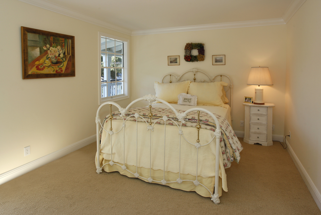 1290 Vallecito Road Carpinteria, CA 93013 - Photo 8 of 12 a bedroom with a bed and a lamp