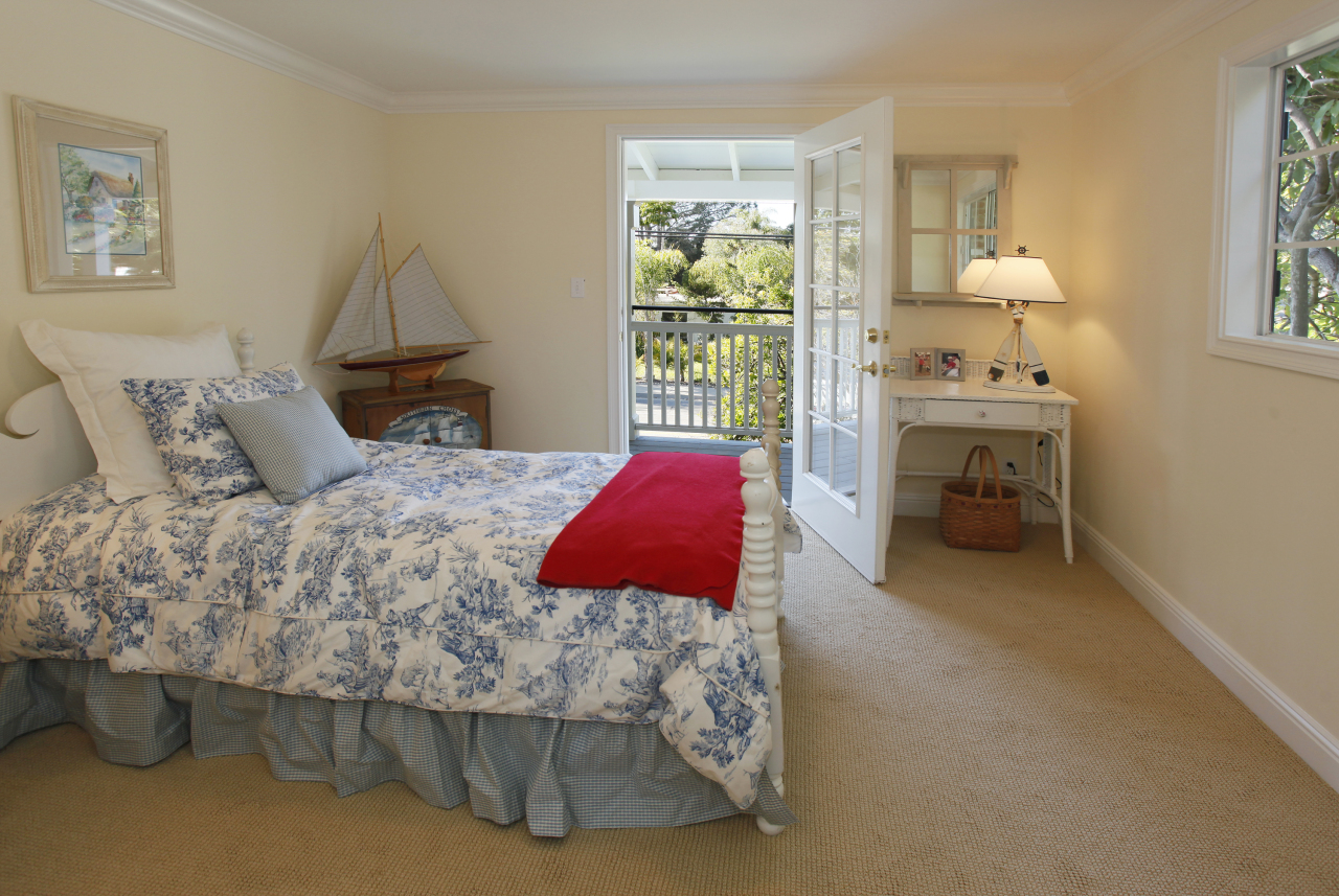 1290 Vallecito Road Carpinteria, CA 93013 - Photo 9 of 12 a bedroom with a bed and a window
